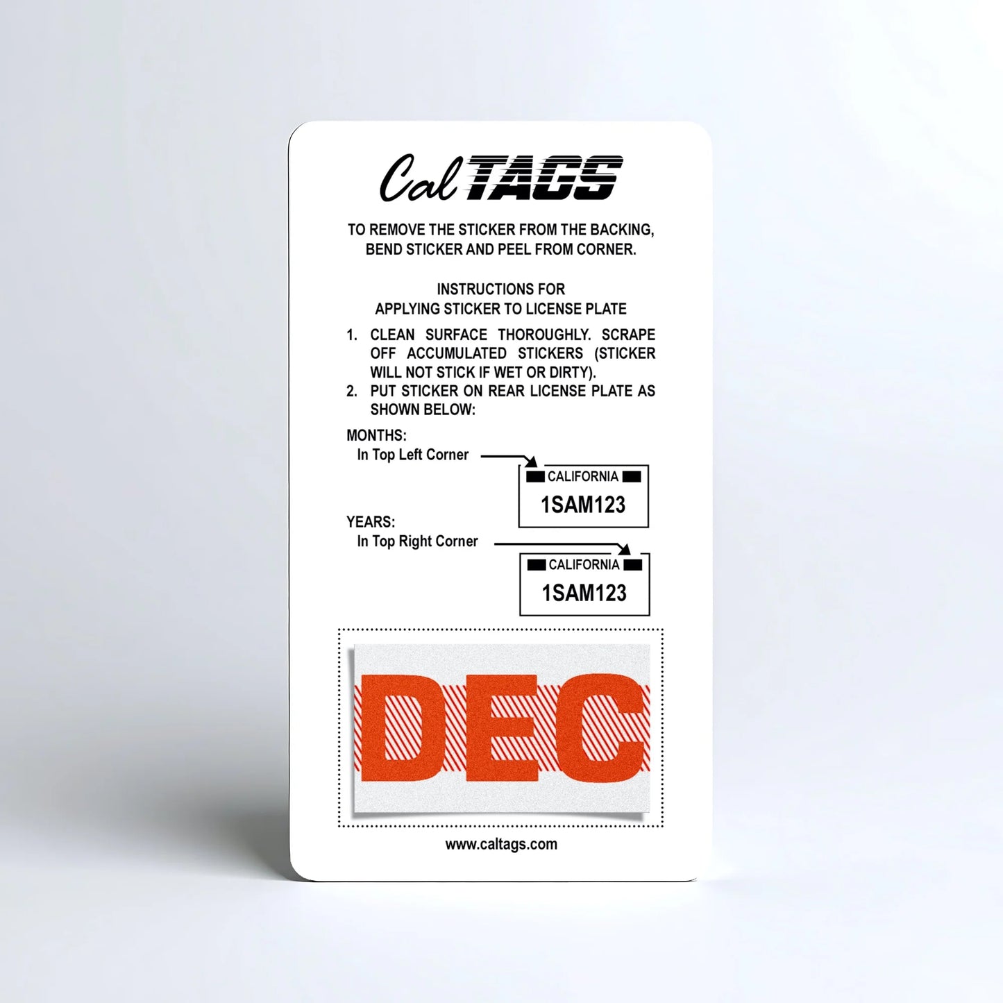 California license plate December month sticker mounted on CalTags display card — Red Series