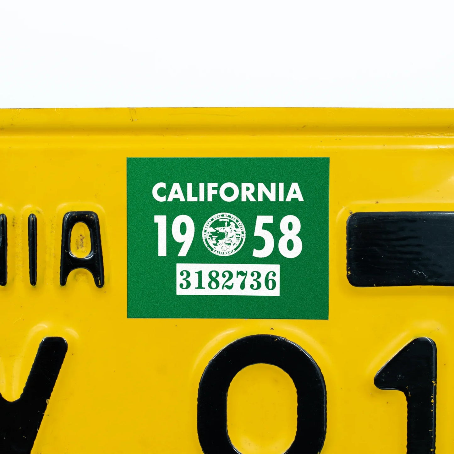 California license plate 1958 year sticker applied to yellow California plate — YOM Series