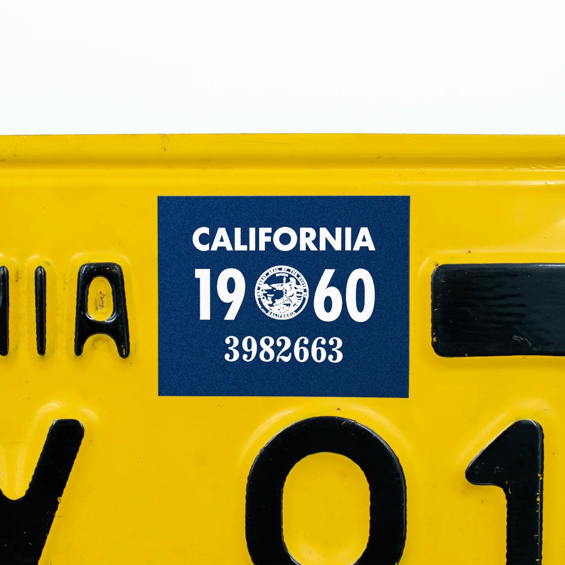California license plate 1960 year sticker applied to yellow California plate — YOM Series