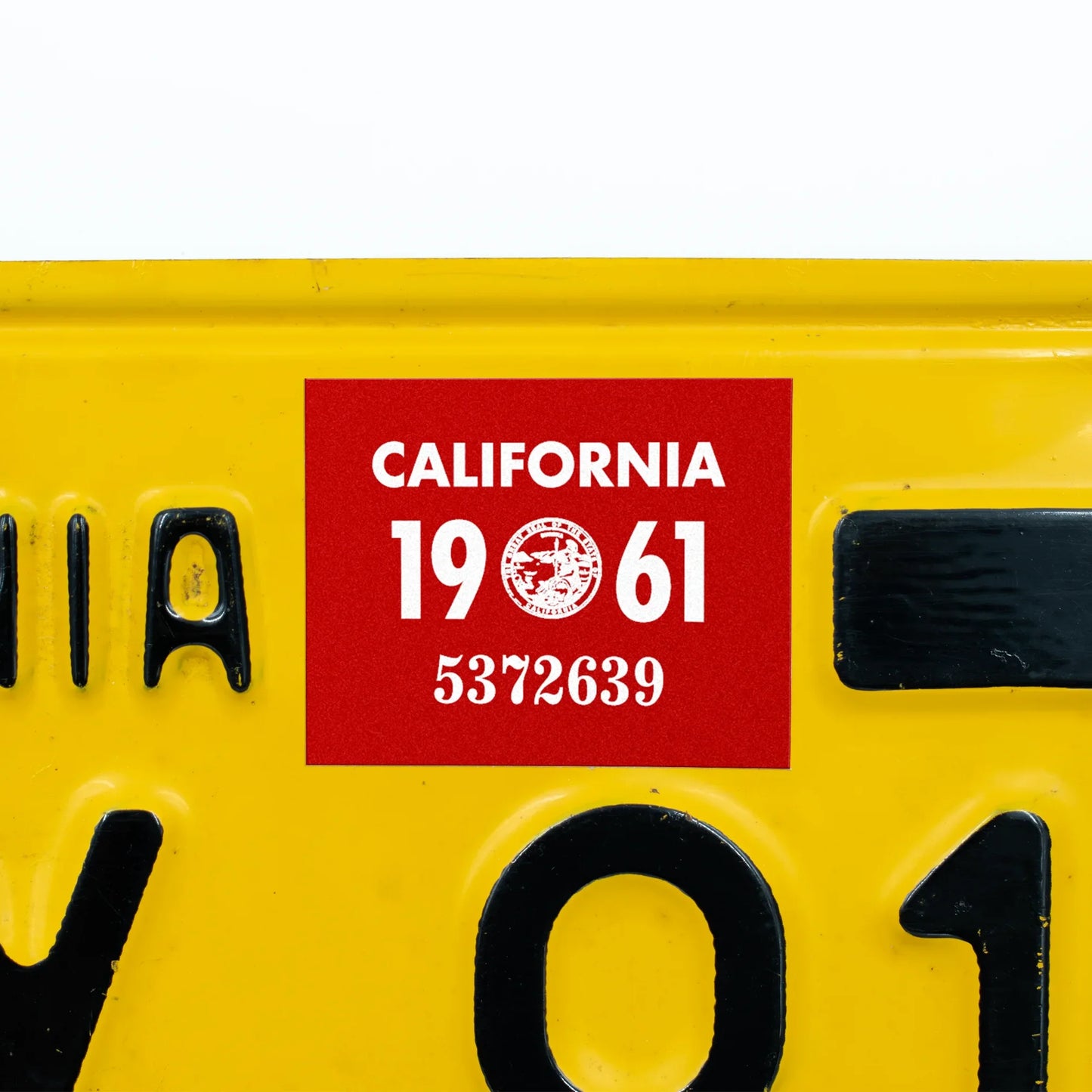 California license plate 1961 year sticker applied to yellow California plate — YOM Series