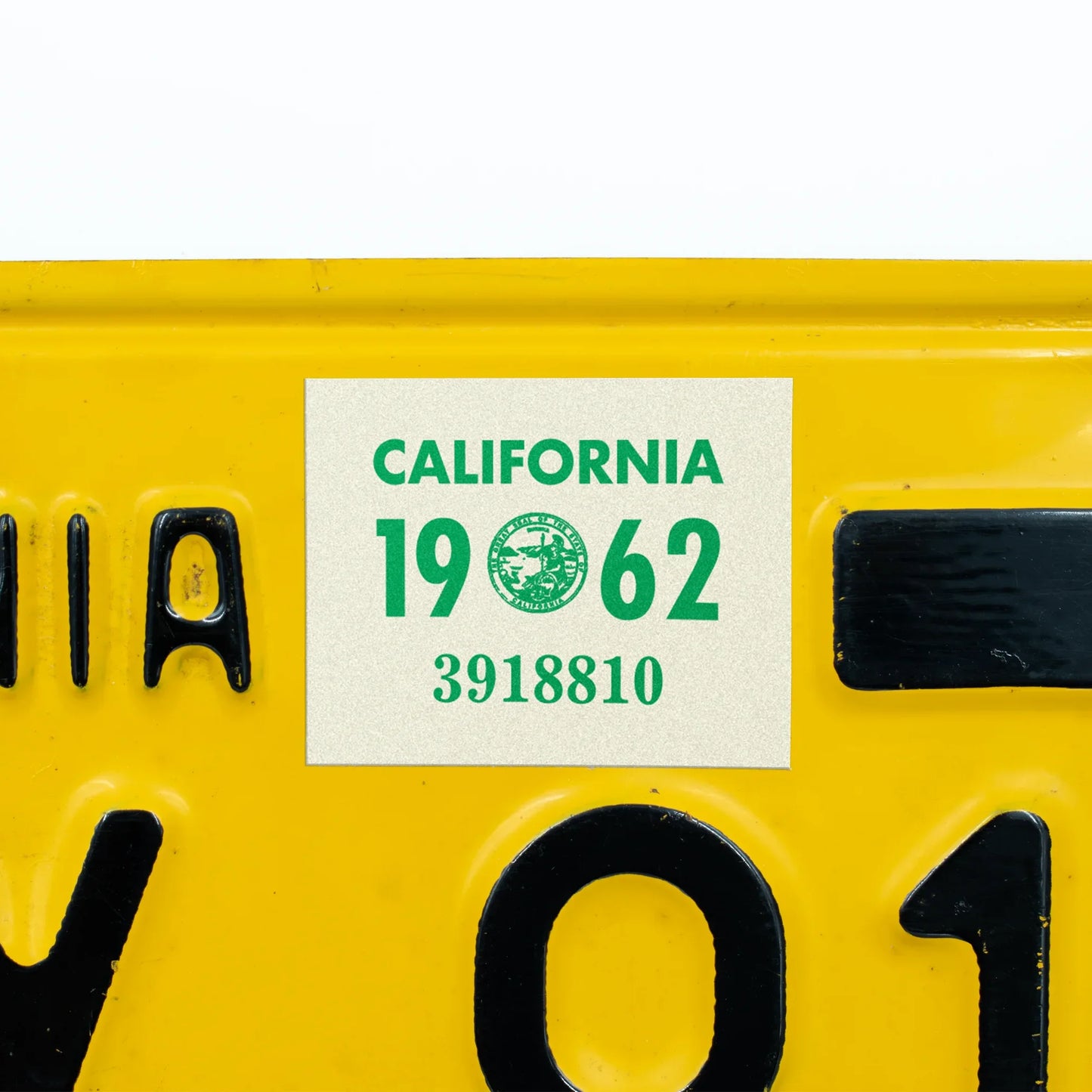 California license plate 1962 year sticker applied to yellow California plate — YOM Series