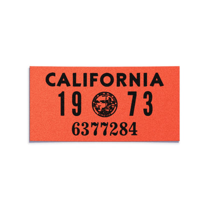 California license plate 1973 year sticker — YOM Series — reproduction shown on white background