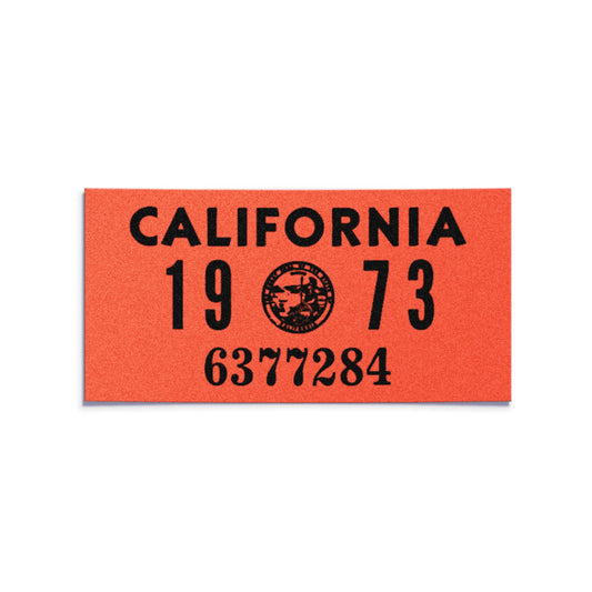 California license plate 1973 year sticker — YOM Series — reproduction shown on white background