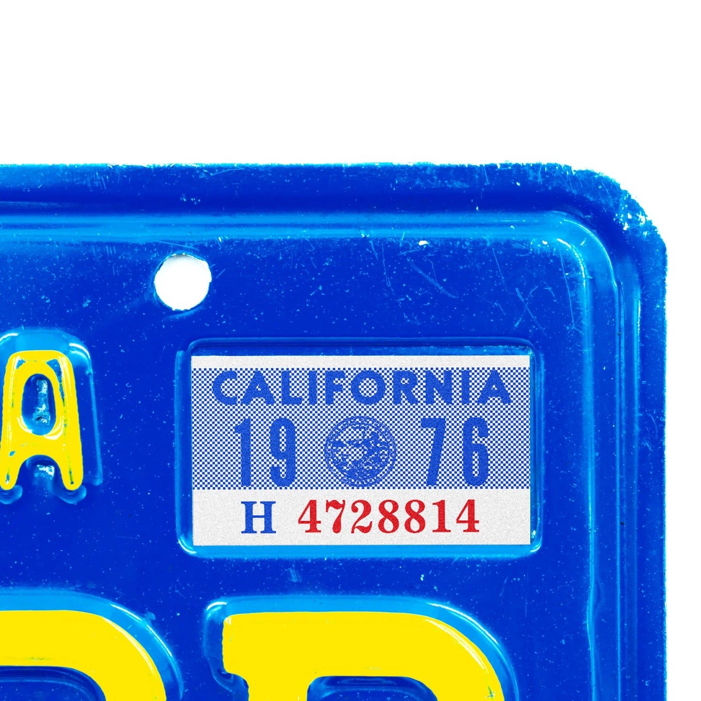 California license plate 1976 year sticker applied to upper corner of blue California plate — YOM Series