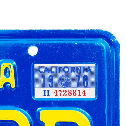 California license plate 1976 year sticker applied to upper corner of blue California plate — YOM Series