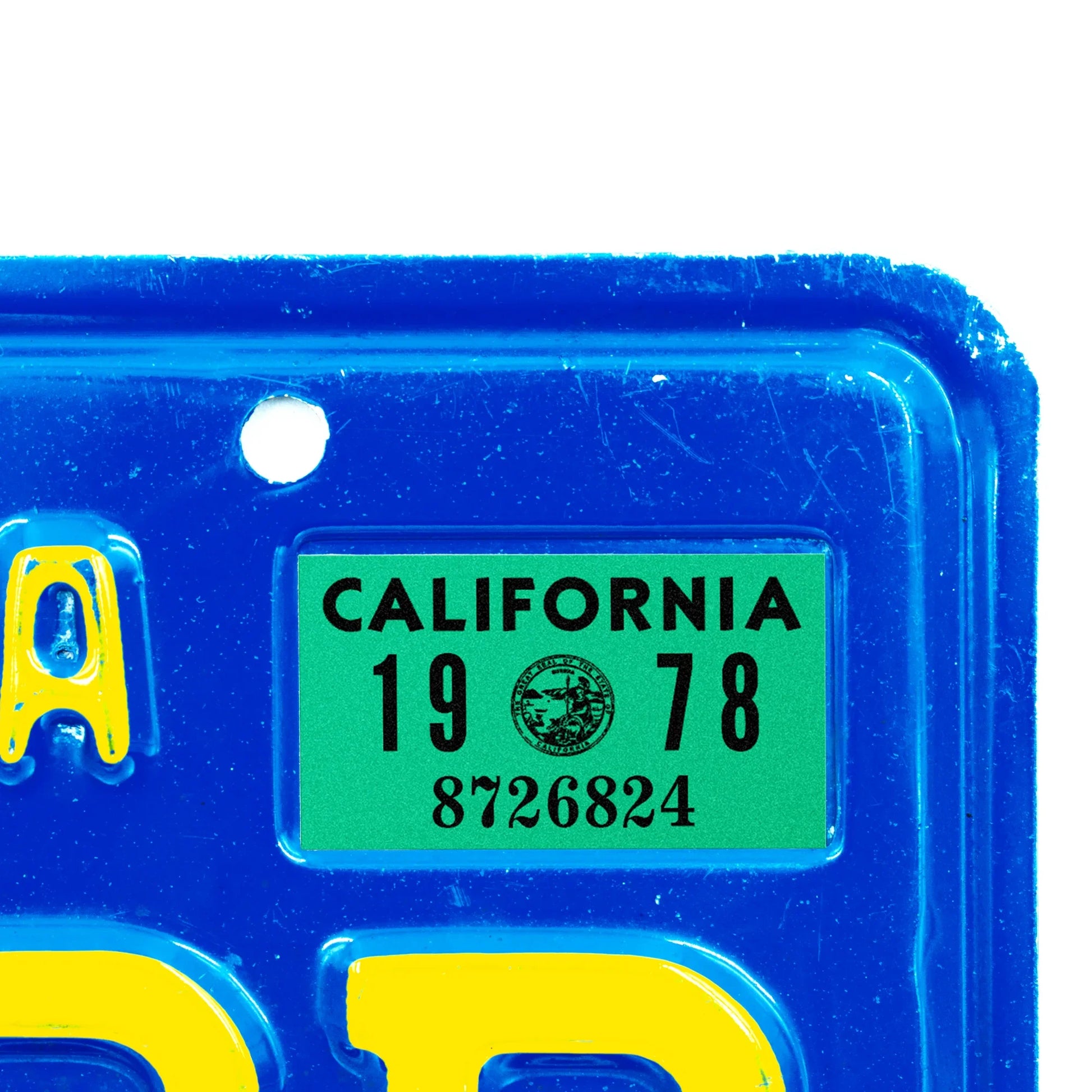 California license plate 1978 year sticker applied to upper corner of blue California plate — YOM Series