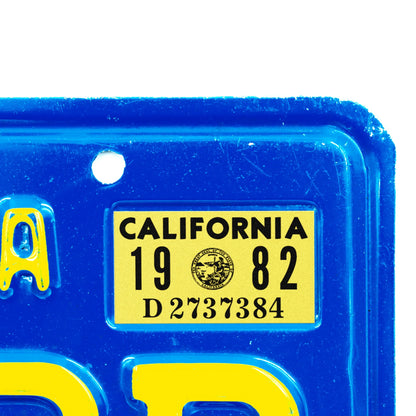 California license plate 1982 year sticker applied to upper corner of blue California plate — Classic Series