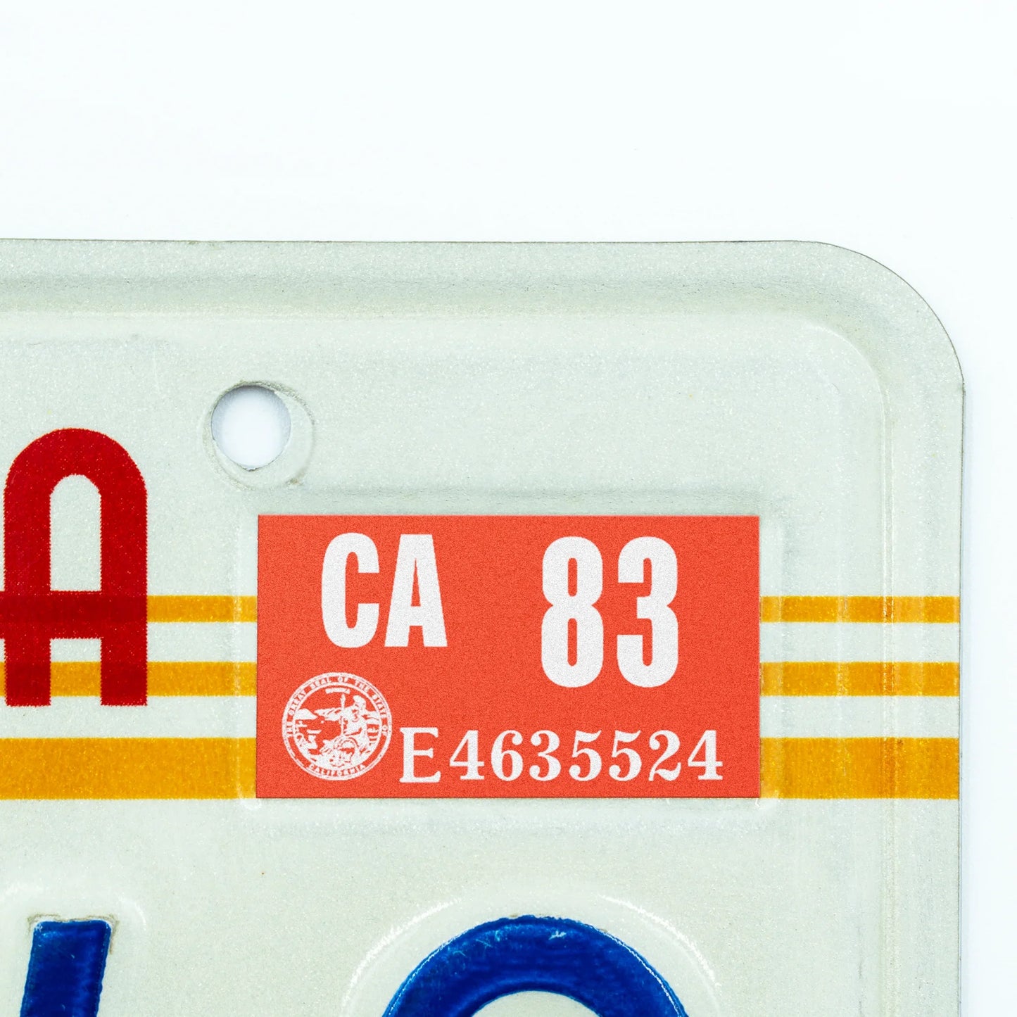 California license plate 1983 year sticker applied to upper corner of 1980s sunset California plate — Classic Series