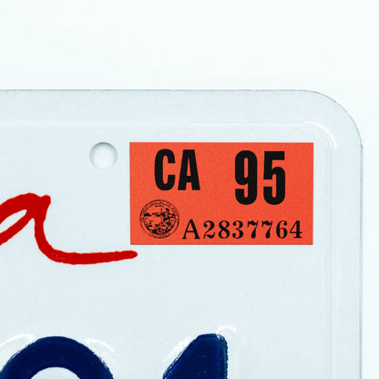 California license plate 1995 year sticker applied to upper corner of white California plate — Classic Series