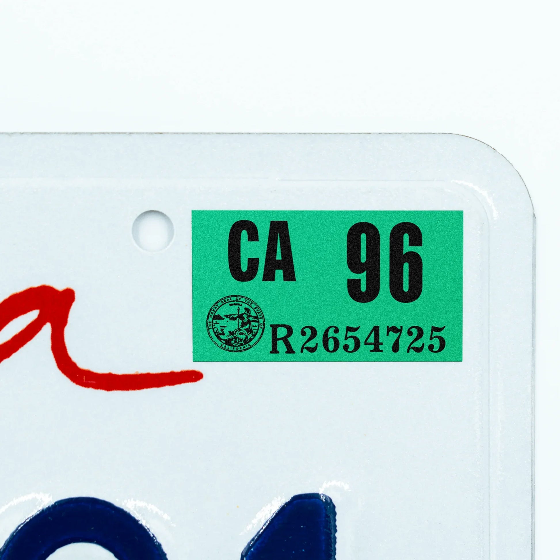 California license plate 1996 year sticker applied to upper corner of white California plate — Classic Series