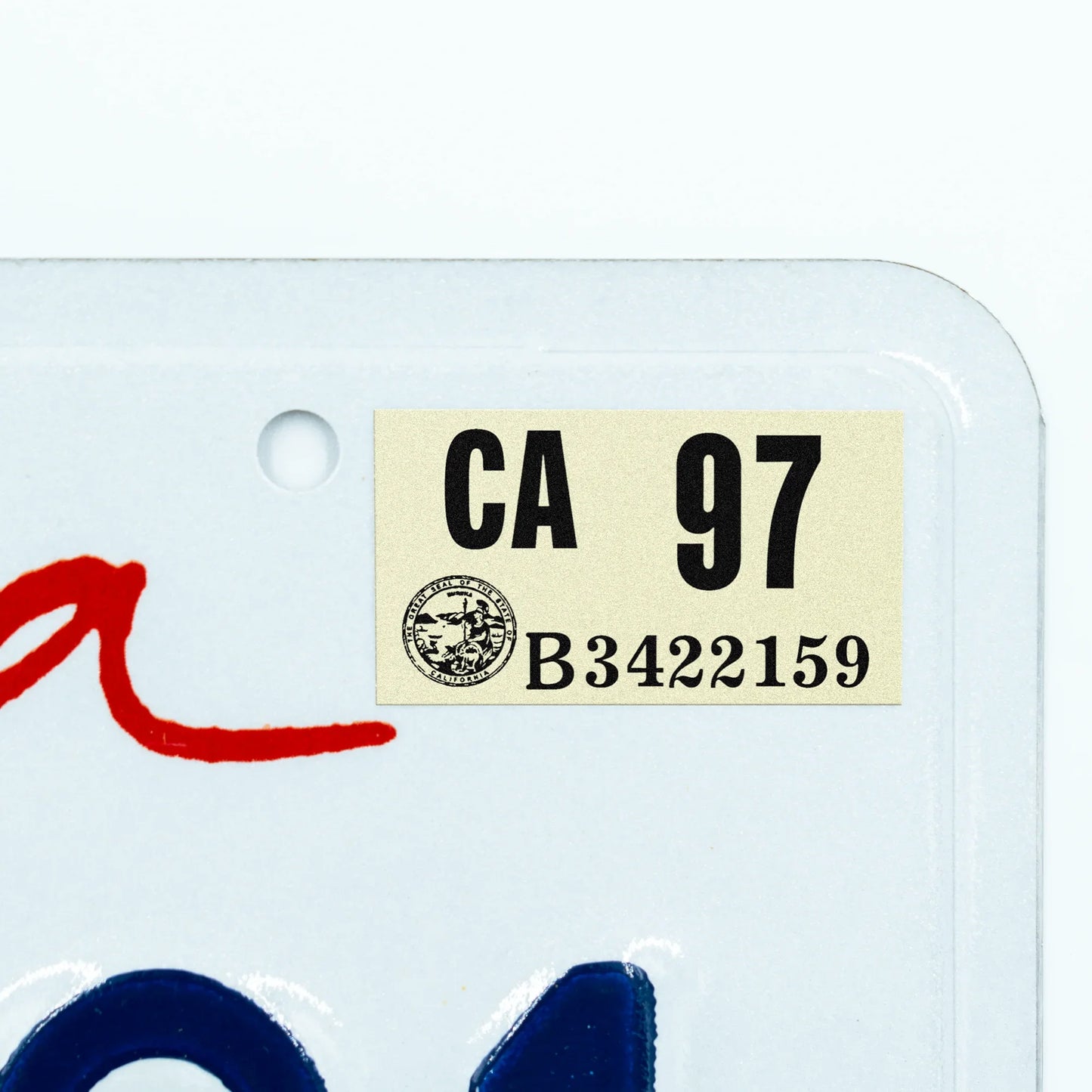 California license plate 1997 year sticker applied to upper corner of white California plate — Classic Series