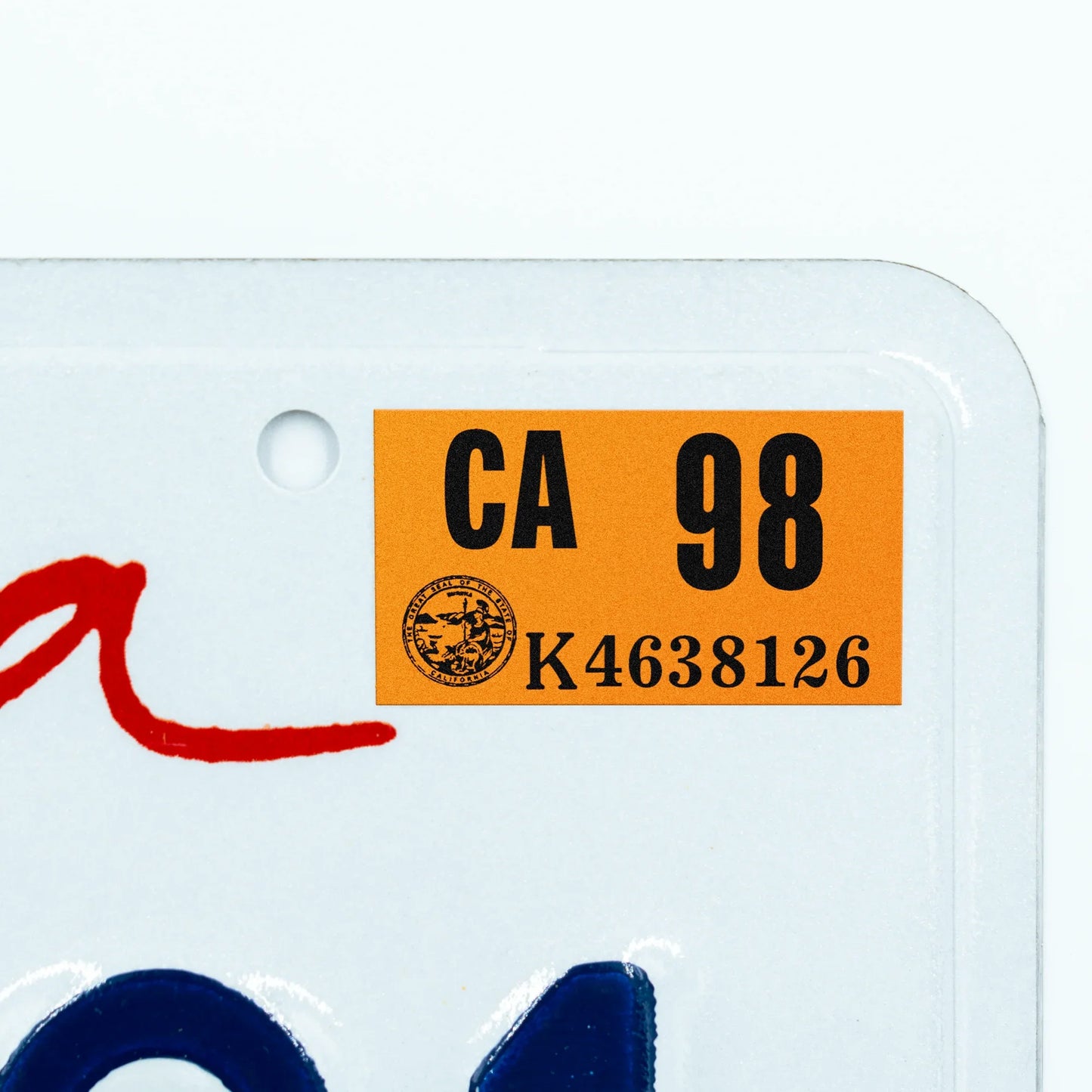 California license plate 1998 year sticker applied to upper corner of white California plate — Classic Series