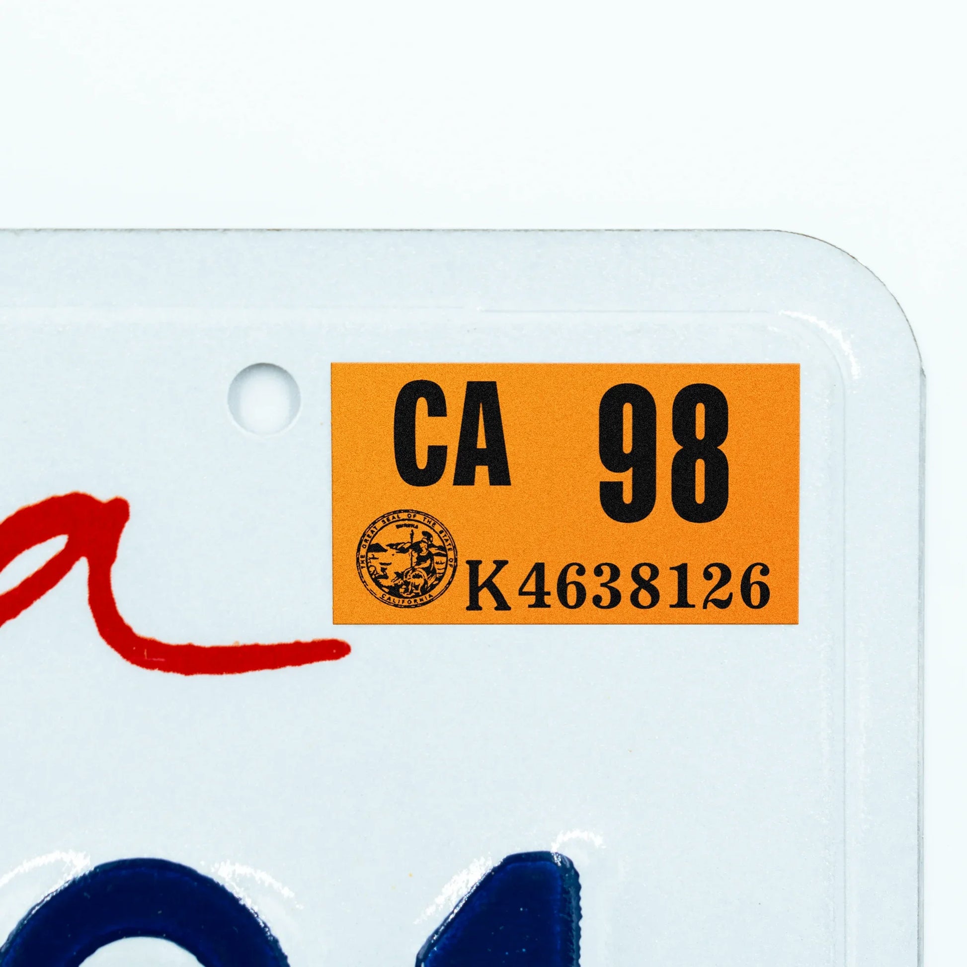 California license plate 1998 year sticker applied to upper corner of white California plate — Classic Series