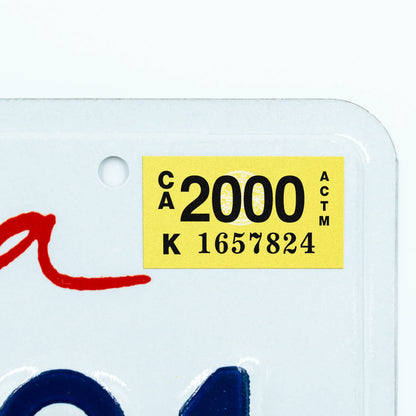 California license plate 2000 year sticker applied to upper corner of white California plate — Classic Series