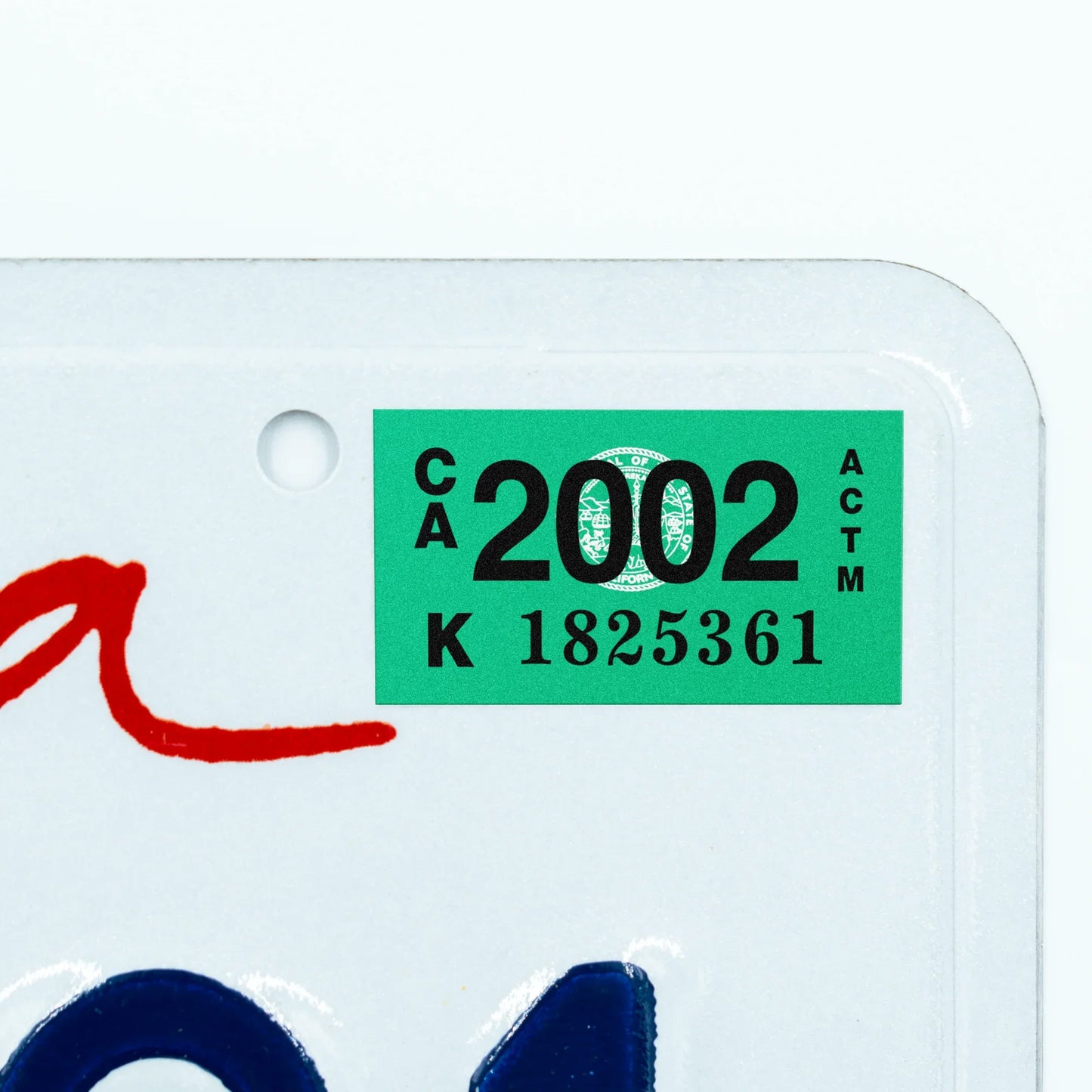 California license plate 2002 year sticker applied to upper corner of white California plate — Classic Series