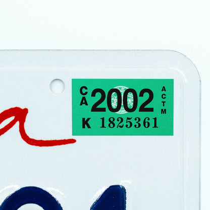 California license plate 2002 year sticker applied to upper corner of white California plate — Classic Series