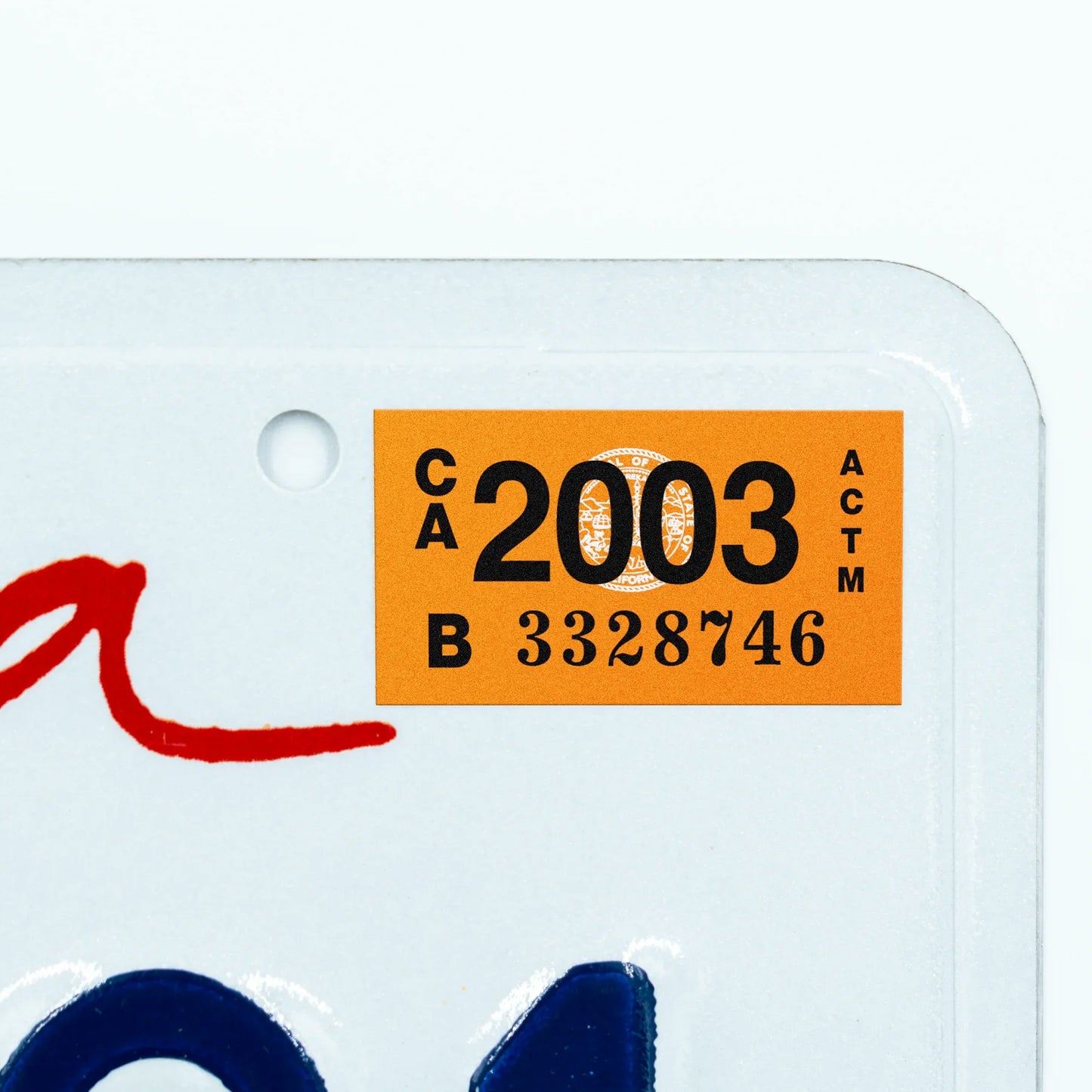 California license plate 2003 year sticker applied to upper corner of white California plate — Classic Series