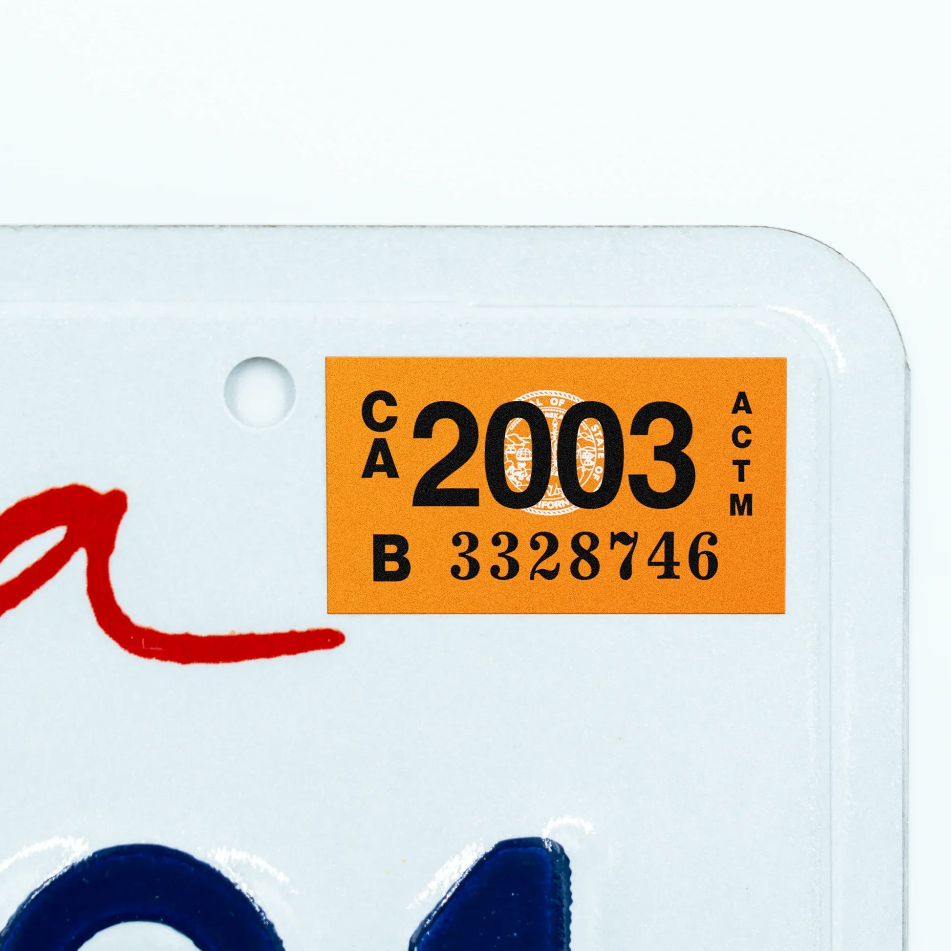 California license plate 2003 year sticker applied to upper corner of white California plate — Classic Series