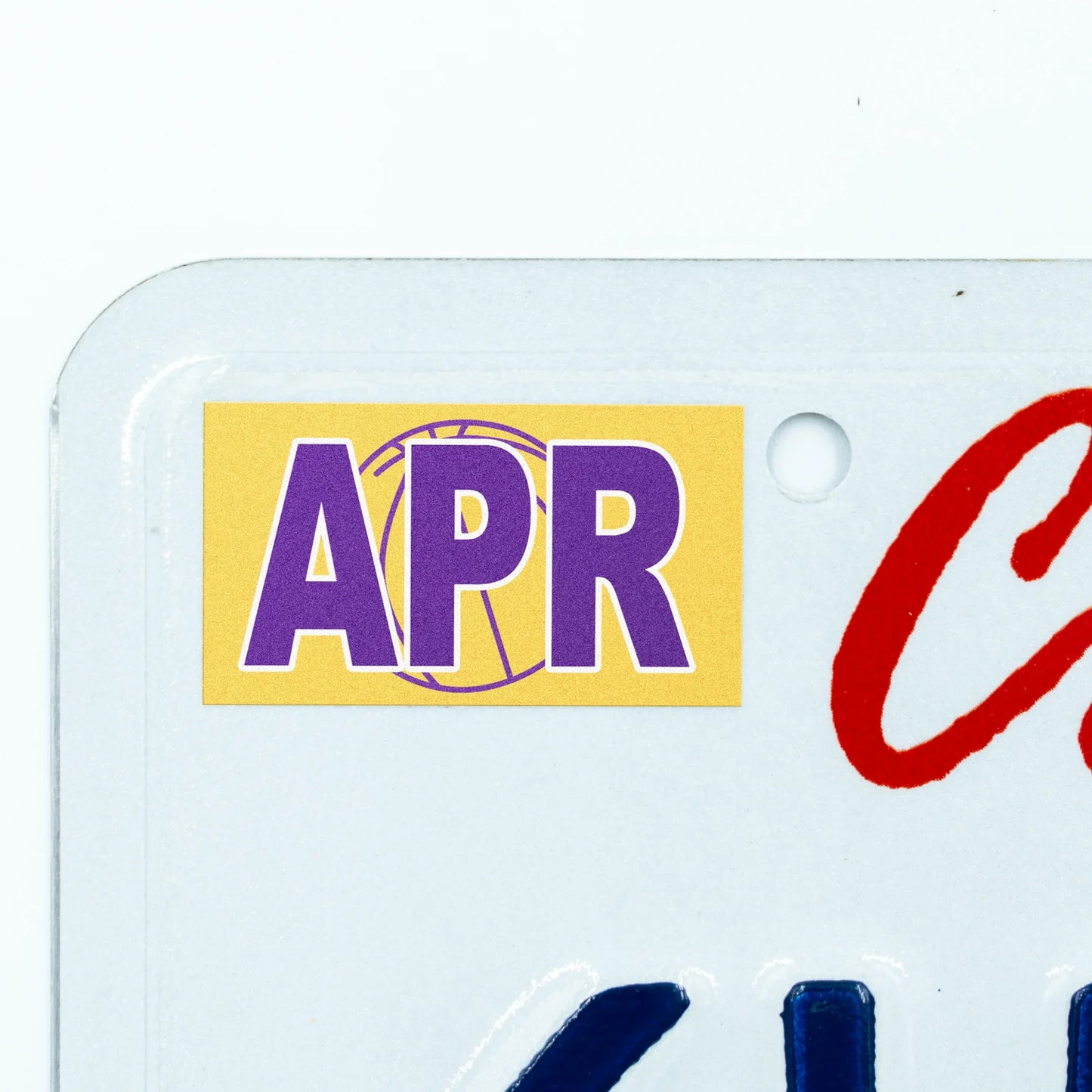 California license plate April month sticker applied to upper corner of white California plate — Courtside Series