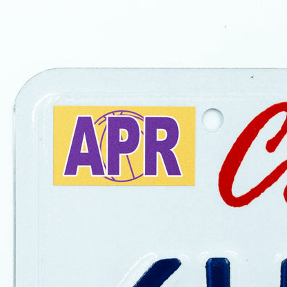 California license plate April month sticker applied to upper corner of white California plate — Courtside Series