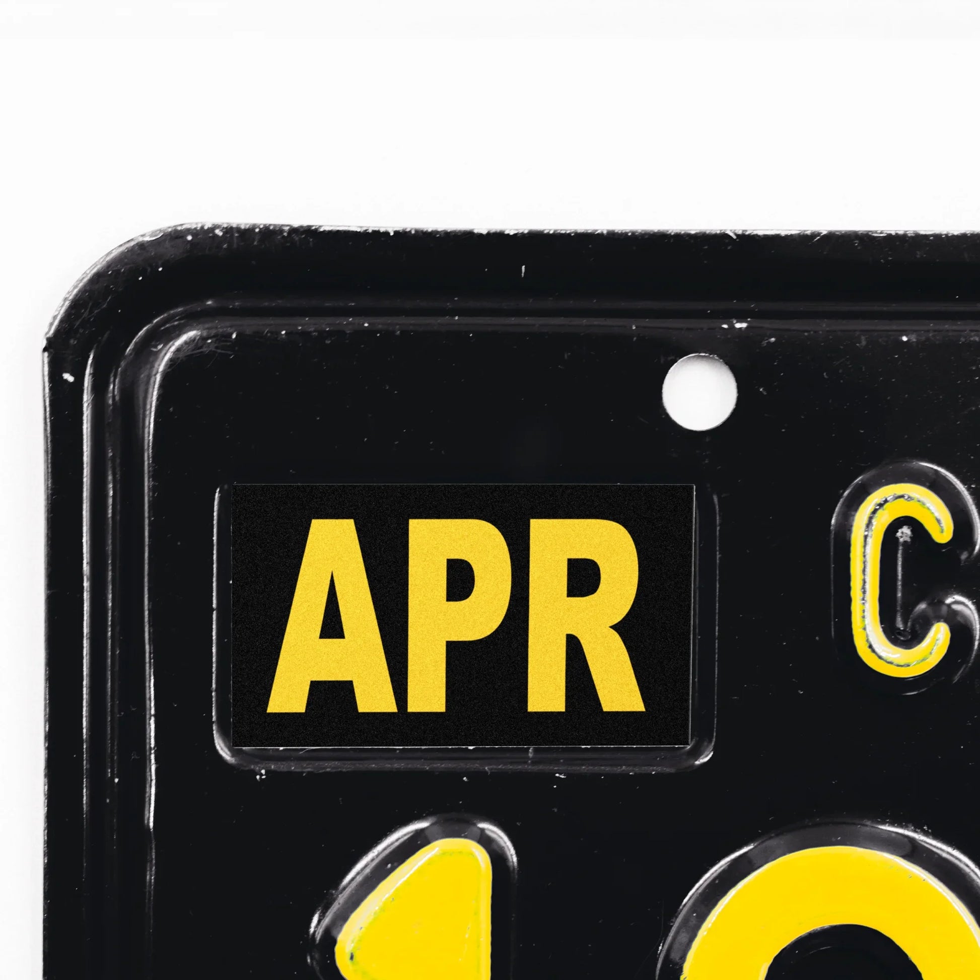 California license plate April month sticker applied to upper corner of black California plate — Legacy Series