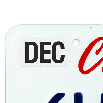California license plate December month sticker applied to upper corner of white California plate — Black Series