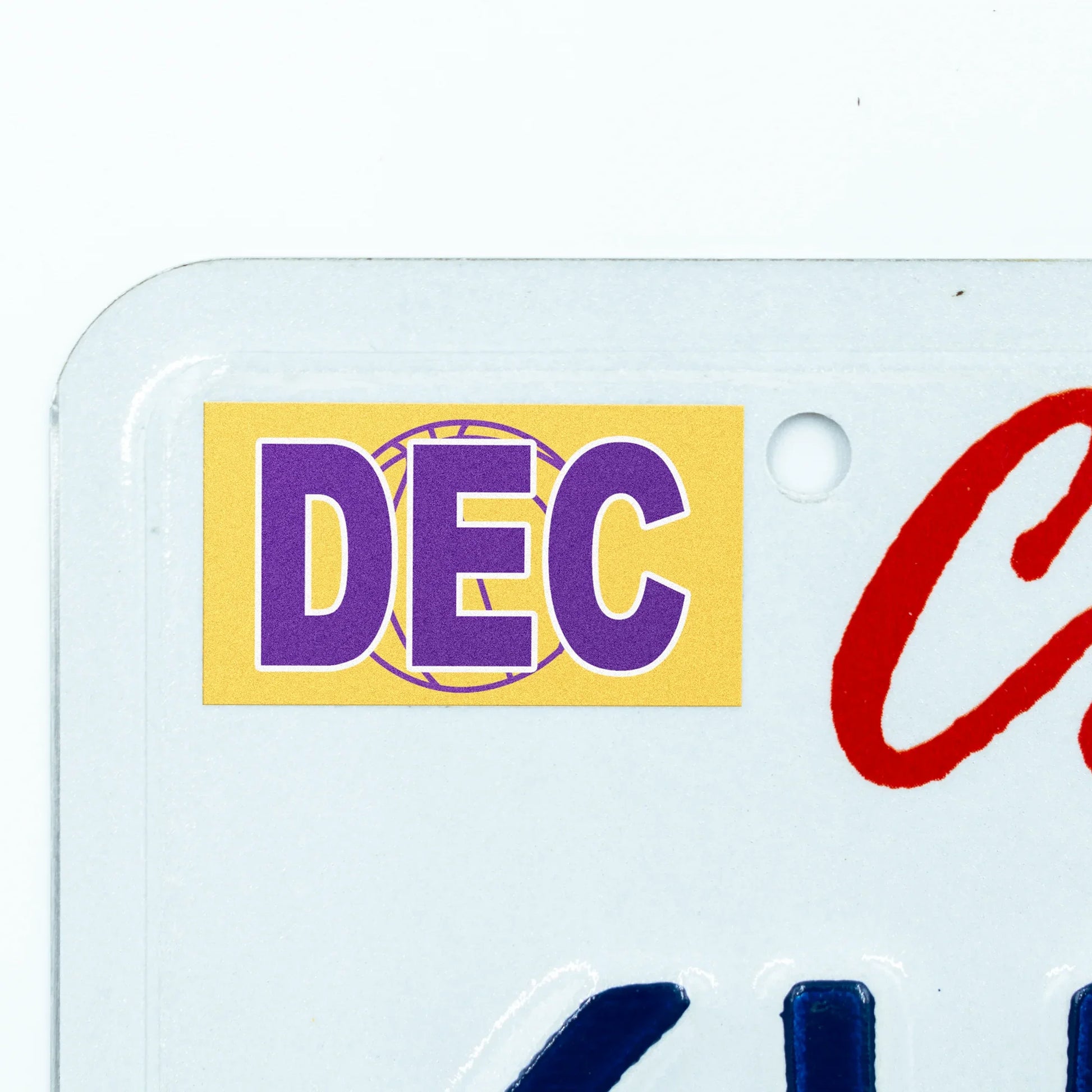 California license plate December month sticker applied to upper corner of white California plate — Courtside Series