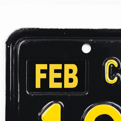 California license plate February month sticker applied to upper corner of black California plate — Legacy Series
