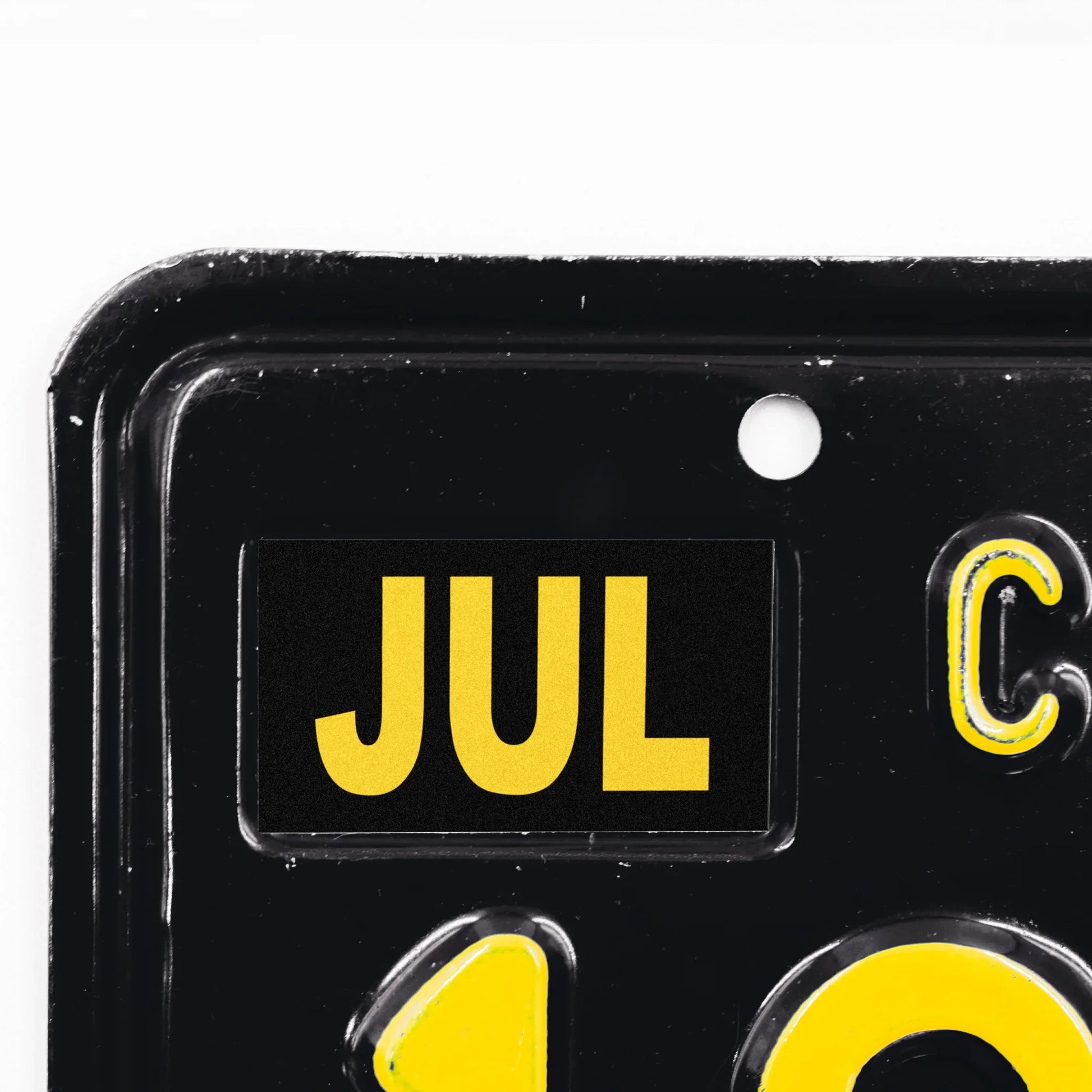 California license plate July month sticker applied to upper corner of black California plate — Legacy Series