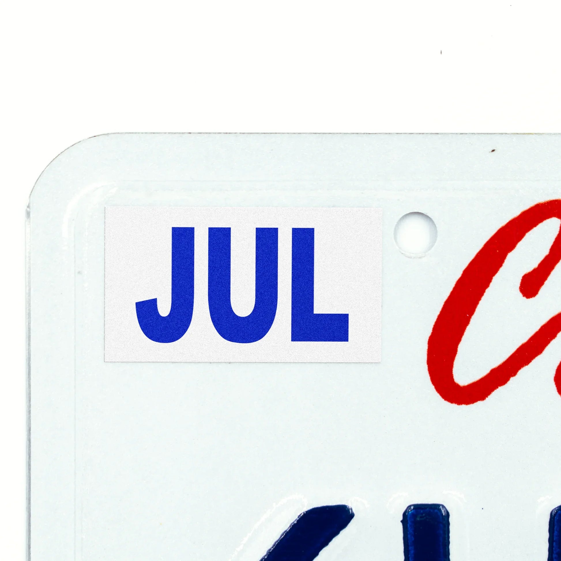 California license plate July month sticker applied to upper corner of white California plate — Modern Series