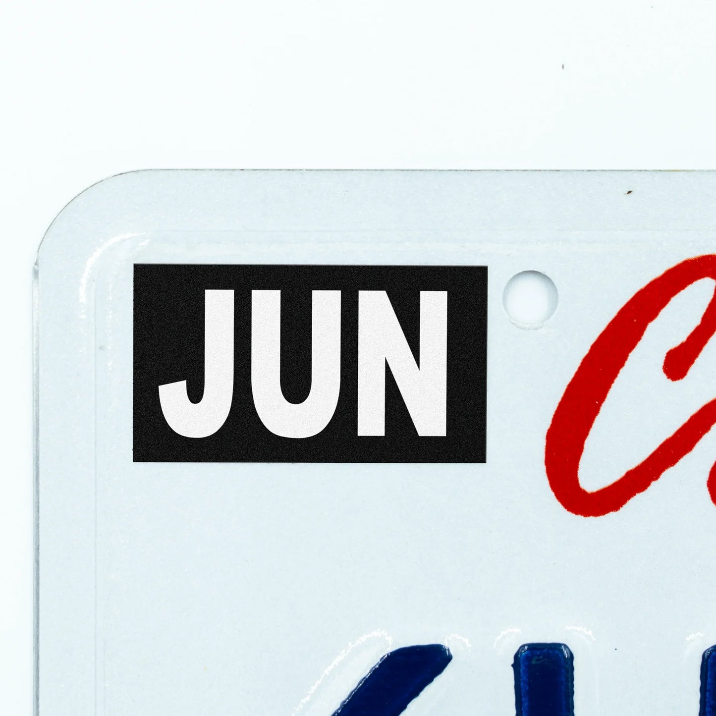 California license plate June month sticker applied to upper corner of white California plate — Stealth Series