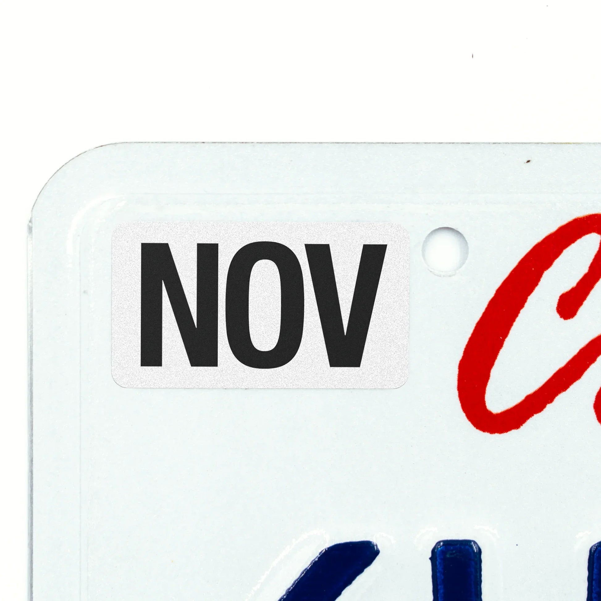 California license plate November month sticker applied to upper corner of white California plate — Black Series