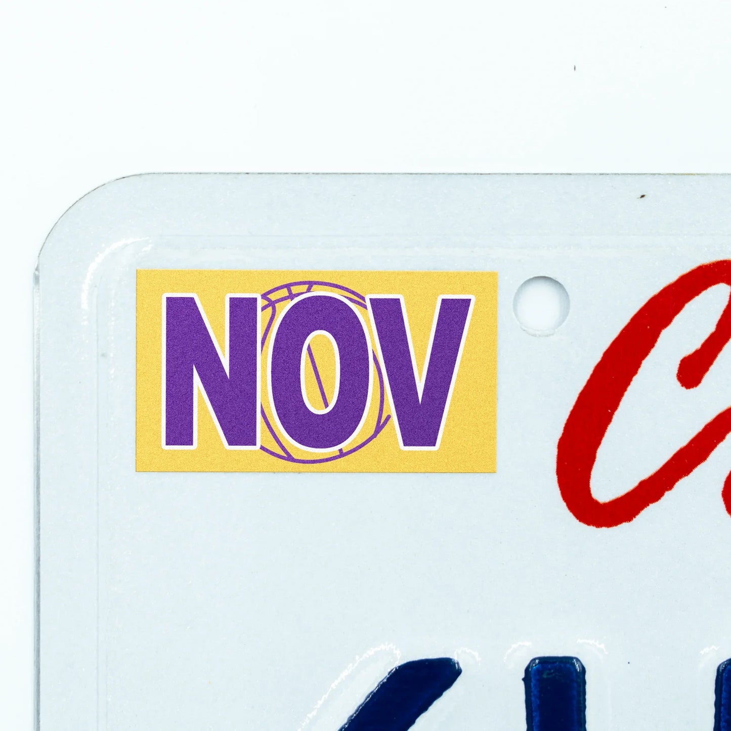 California license plate November month sticker applied to upper corner of white California plate — Courtside Series