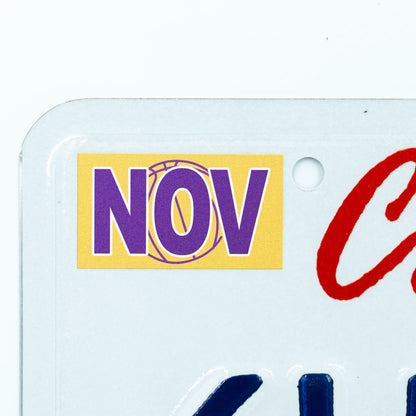 California license plate November month sticker applied to upper corner of white California plate — Courtside Series
