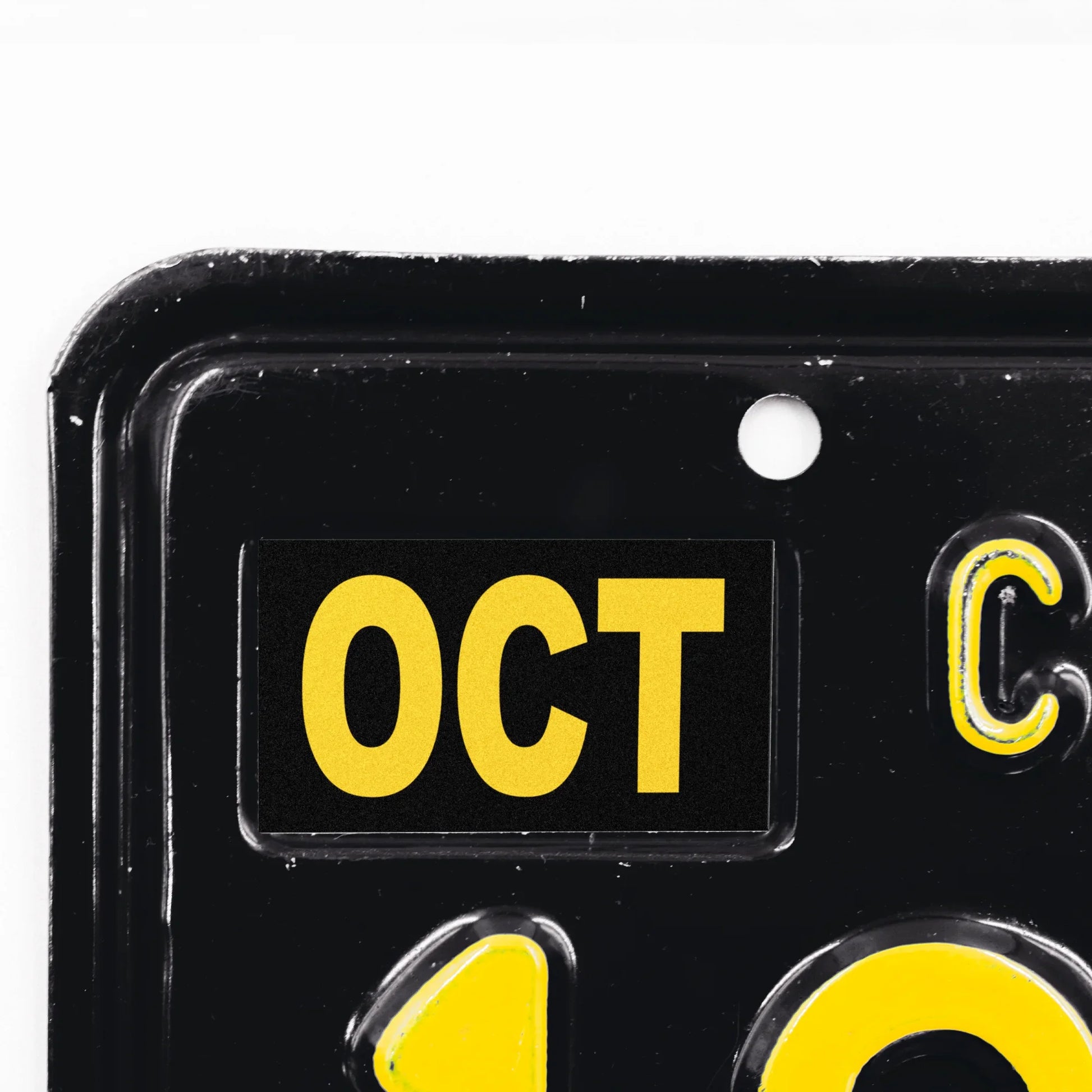 California license plate October month sticker applied to upper corner of black California plate — Legacy Series