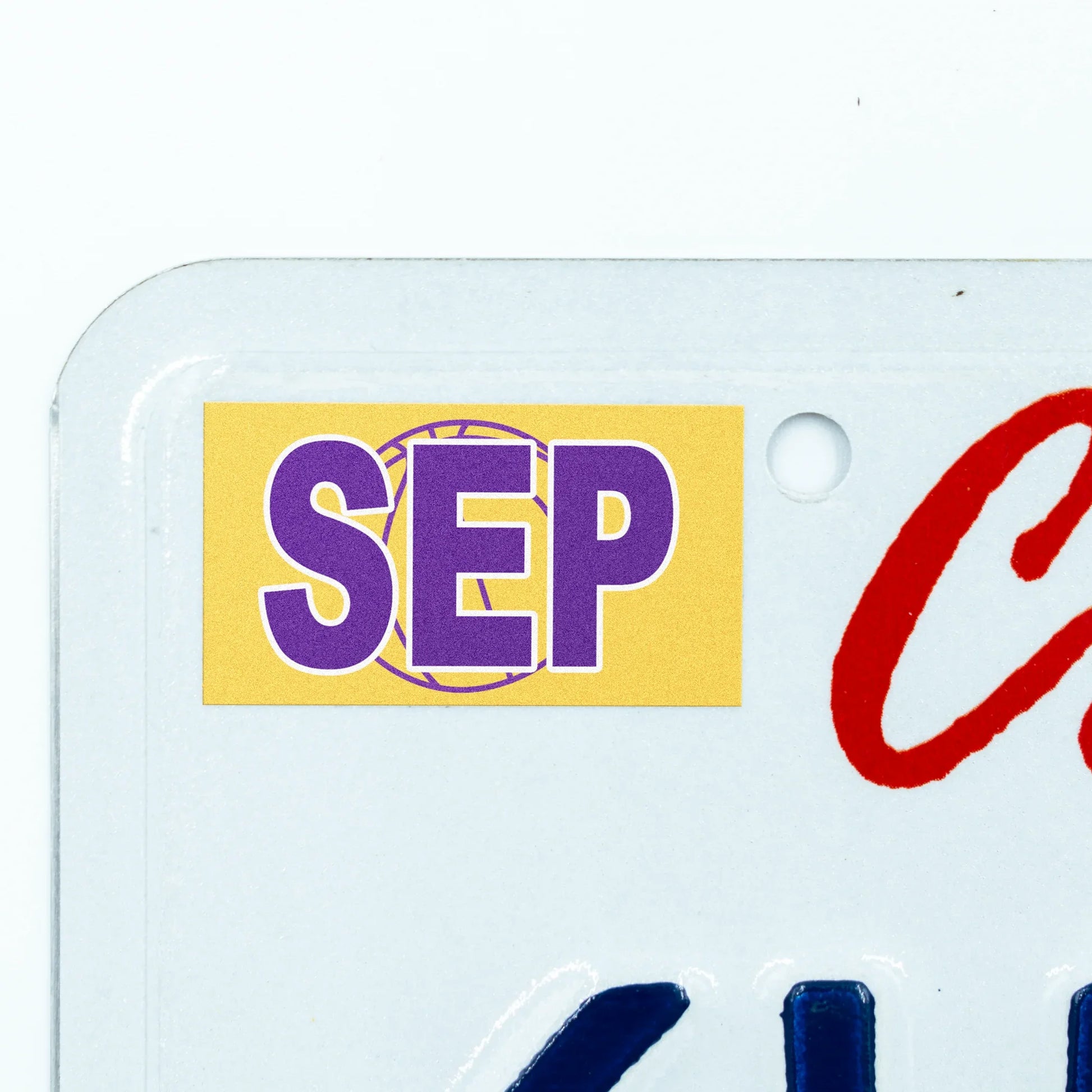 California license plate September month sticker applied to upper corner of white California plate — Courtside Series
