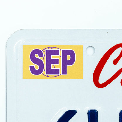 California license plate September month sticker applied to upper corner of white California plate — Courtside Series
