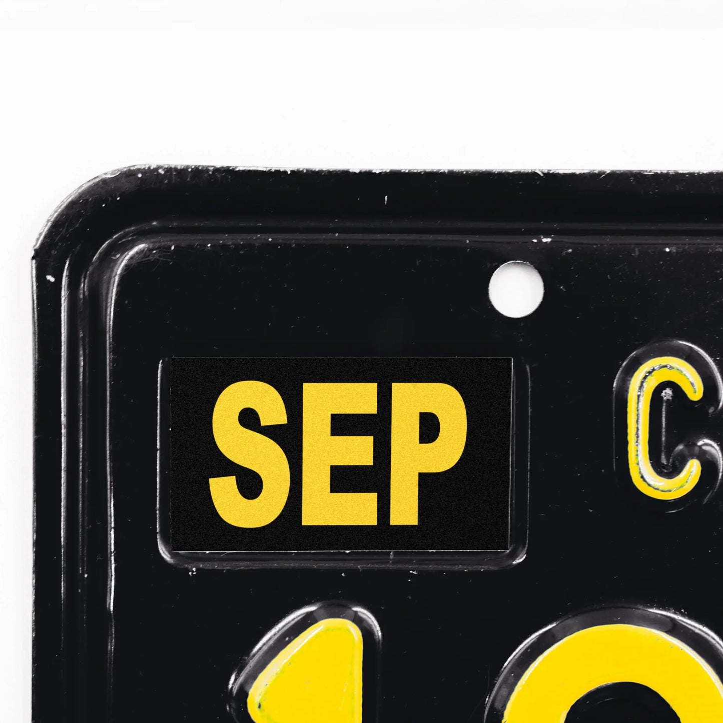 California license plate September month sticker applied to upper corner of black California plate — Legacy Series